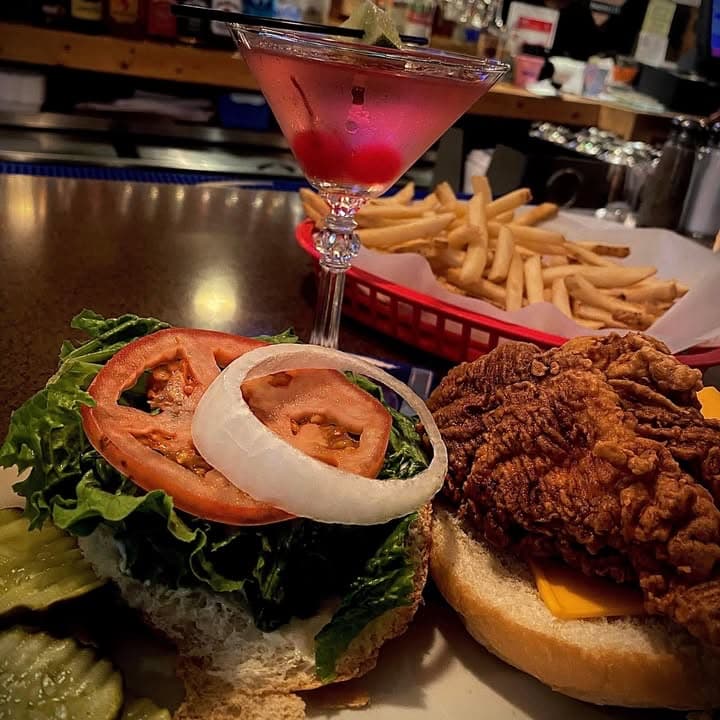 A breaded chicken sandwich and a basket of fries at the bar, from the House of Coates Facebook page.